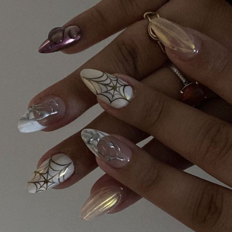 Metallic chrome spider web on dark halloween nails