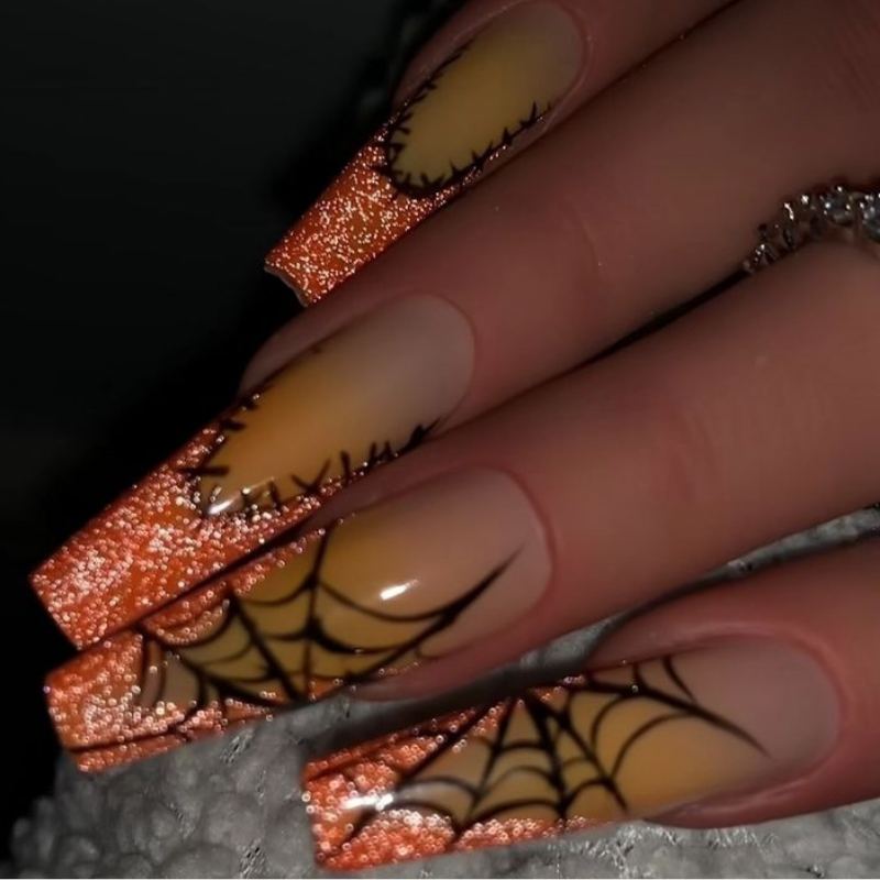 Elegant coffin-shaped nails with burgundy halloween design