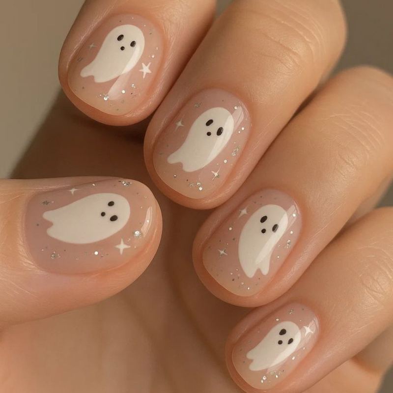 Ghost face halloween nail art on simple white base