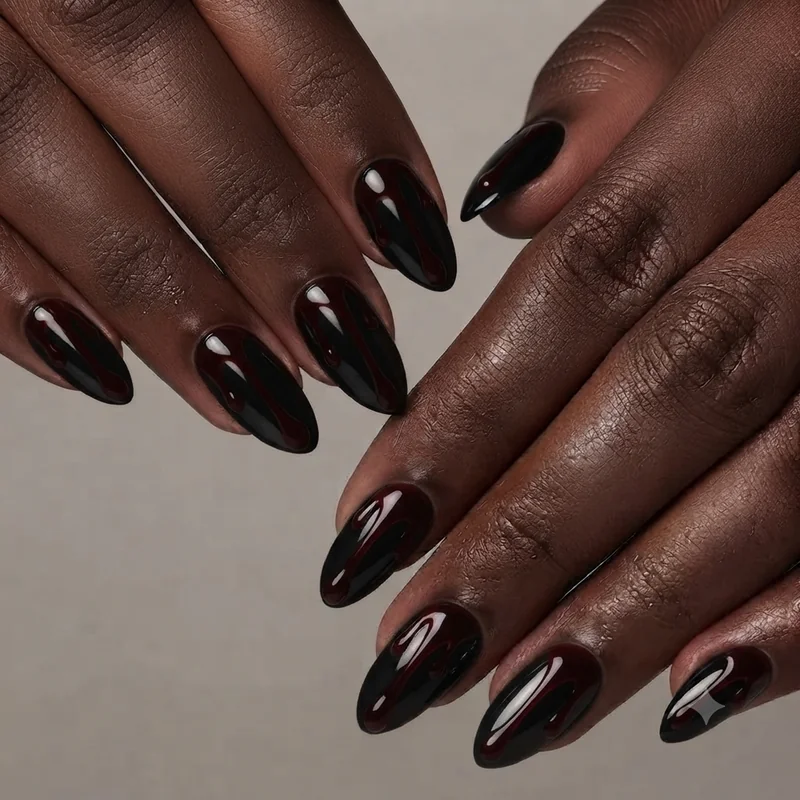 Dark gothic glam black chrome blood drip halloween nail design manicure 2026