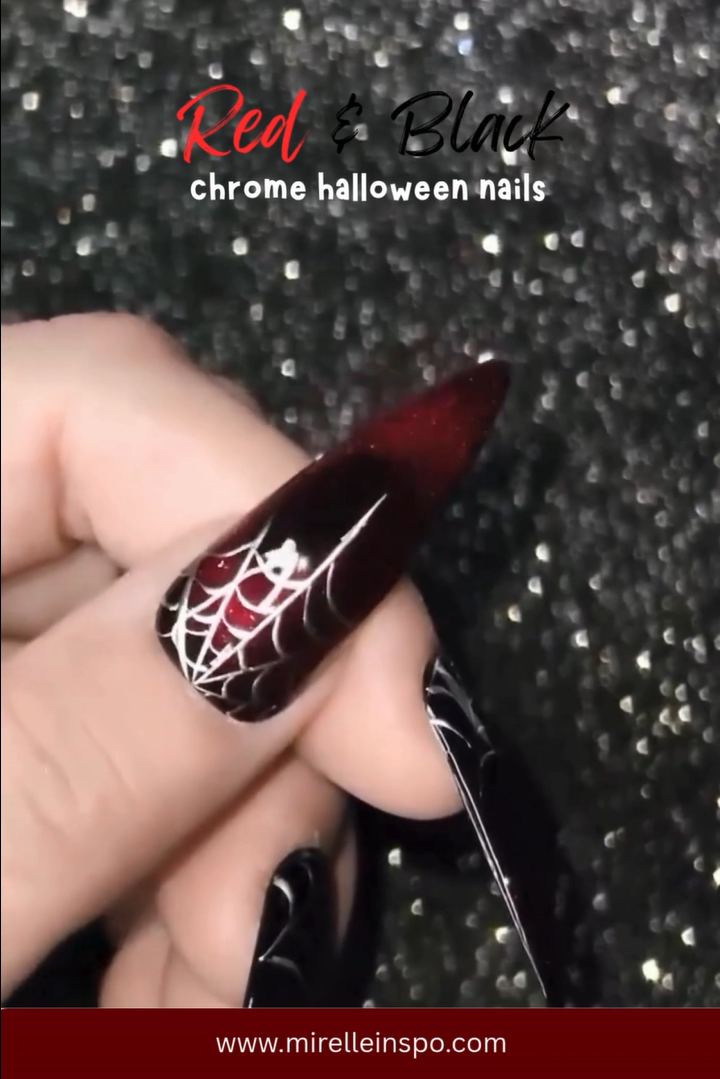 Red chrome Halloween nails with black geometric accents