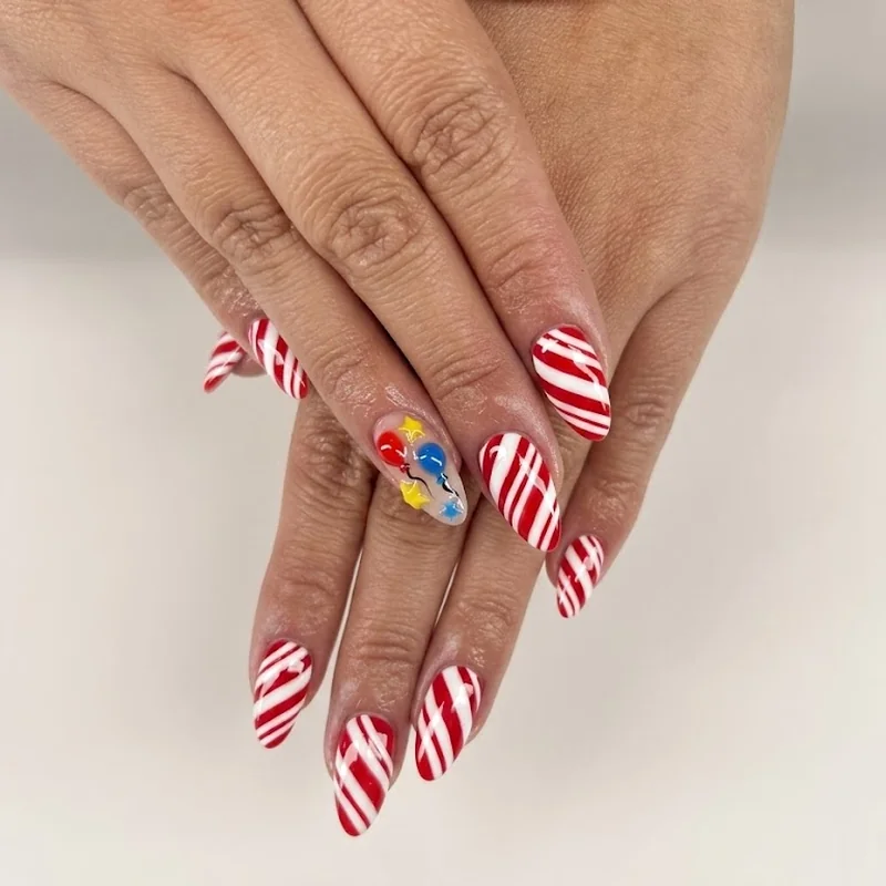 Circus inspired candy stripe maximalist manicure with sculptural 3D accent nail