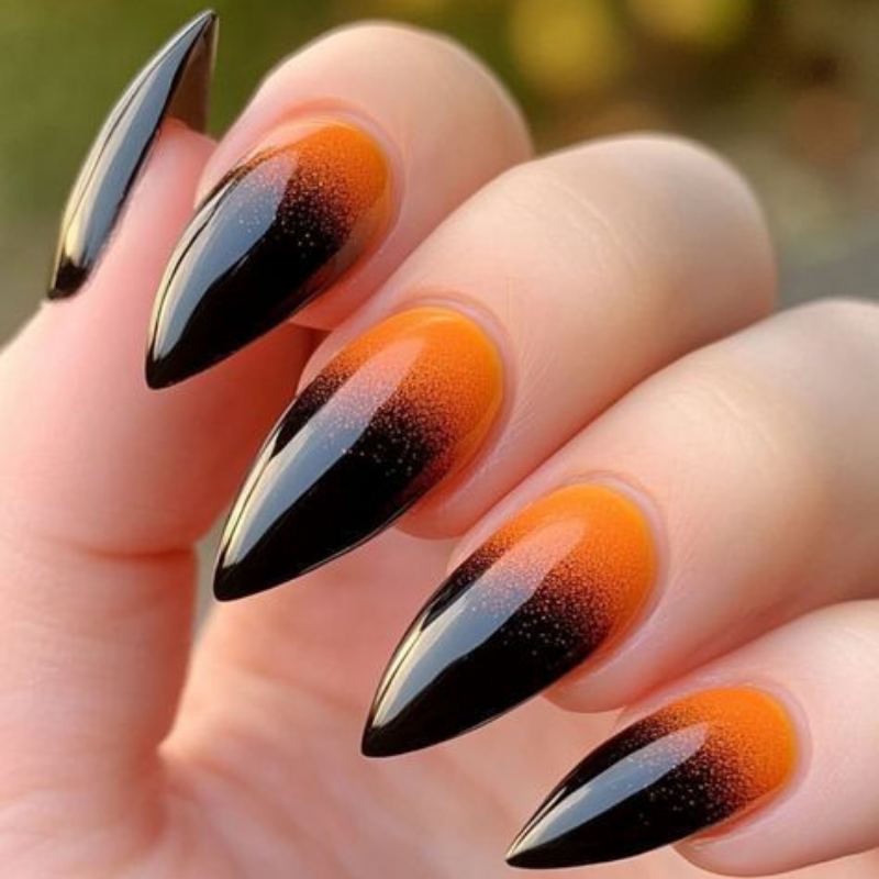 Gradient ombre halloween nails from orange to black