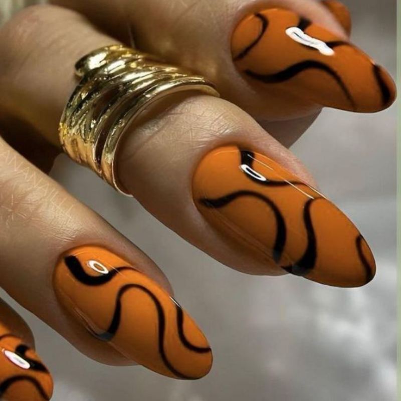 Orange and black marble swirl halloween nail designs