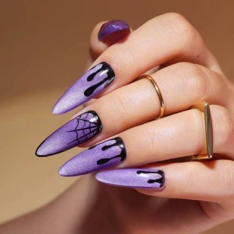 Deep purple witch-themed halloween nail designs with stars