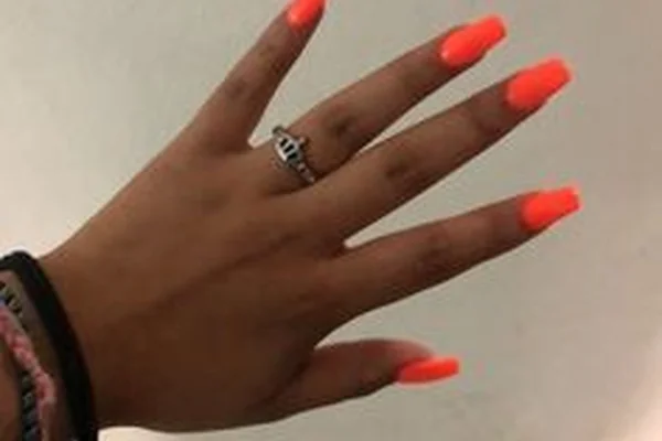 Summer 2025 bright neon coral nails with high gloss finish short square shape vibrant vacation ready manicure