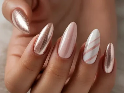New Years Eve 2025 champagne chrome nails with rose gold accent and high gloss finish for glamorous party look
