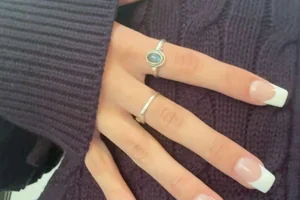 Year round classic French manicure with white tips on natural pink base short square shape timeless design